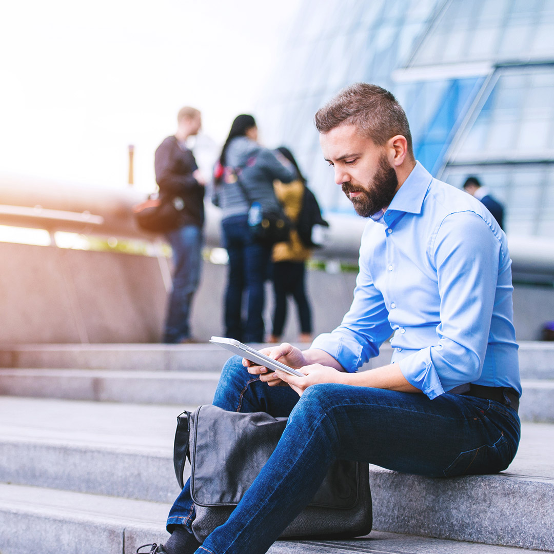 Tablet-Man-Outdoors-City-SQUARE.jpg