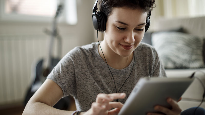young-adult-teenager-tablet-headphones-music_1920x1080.jpg